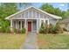 Charming home with a stone walkway, attractive landscaping, and a red front door at 222 N Weldon St, Gastonia, NC 28052