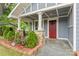 Inviting front entrance with charming columns and lush landscaping at 222 N Weldon St, Gastonia, NC 28052