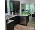 Modern kitchen with dark cabinets, stainless steel appliances and tile backsplash at 222 N Weldon St, Gastonia, NC 28052