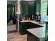 Modern kitchen with dark cabinets, stainless steel appliances and view to living room at 222 N Weldon St, Gastonia, NC 28052
