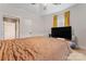 Comfortable main bedroom with carpet, ceiling fan, bright windows and a view into a sitting room at 222 N Weldon St, Gastonia, NC 28052