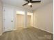 Bedroom with carpet, closet, and a ceiling fan for added comfort at 233 Northwest Dr, Davidson, NC 28036