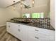 Kitchen with dark counter, overhead lighting, open layout, and a view of the living space at 233 Northwest Dr, Davidson, NC 28036