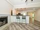Living area with island seating, fireplace, and access to other rooms in the house at 233 Northwest Dr, Davidson, NC 28036