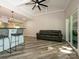 Living area with wood floors, a leather sofa, and sliding glass doors to the outside at 233 Northwest Dr, Davidson, NC 28036