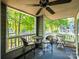 Inviting outdoor patio with lake views, ceiling fan, and comfortable seating at 233 Northwest Dr, Davidson, NC 28036