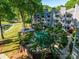Community pool surrounded by lush landscaping and well-maintained residential buildings at 233 Northwest Dr, Davidson, NC 28036