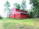 Red barn with a green roof in a field at 2530 Sharon Rd, York, SC