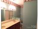 Well-lit bathroom with double sinks, a vanity, and a tub and shower combo at 2530 Sharon Rd, York, SC