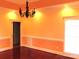 Dining room featuring cherry hardwood floors, a modern chandelier, and neutral paint at 2530 Sharon Rd, York, SC