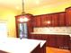 Bright kitchen features stainless appliances, custom wood cabinets, and quartz countertops at 2530 Sharon Rd, York, SC