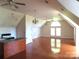 Open-concept living room with hardwood floors, ceiling fans, and natural light at 2530 Sharon Rd, York, SC