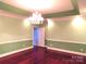 Bright, comfortable living room with hardwood floors and a classic chandelier at 2530 Sharon Rd, York, SC