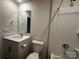 Functional bathroom with a shower-tub, toilet, and a white single-sink vanity with mirror at 2554 Goose Fair Rd, Maiden, NC 28650