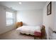 This bedroom has neutral carpet, a side window for natural light, and simple decor at 2554 Goose Fair Rd, Maiden, NC 28650