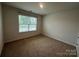 Simple bedroom with a window and plush carpet, offers a calming and uncluttered atmosphere at 2554 Goose Fair Rd, Maiden, NC 28650