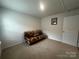 Bedroom featuring a unique futon, neutral carpet, and simple decor at 2554 Goose Fair Rd, Maiden, NC 28650
