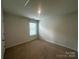 Cozy bedroom featuring neutral carpet, natural light, and standard electrical outlets at 2554 Goose Fair Rd, Maiden, NC 28650