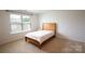 Cozy bedroom with carpeted floors, bright window, and natural light at 2554 Goose Fair Rd, Maiden, NC 28650