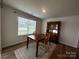 Dining room with a wooden table set and china cabinet, illuminated by natural light at 2554 Goose Fair Rd, Maiden, NC 28650