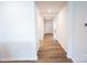 Bright hallway with neutral paint, laminate flooring, and recessed lighting at 2554 Goose Fair Rd, Maiden, NC 28650