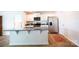 Bright kitchen with stainless steel appliances, white cabinets and a granite island at 2554 Goose Fair Rd, Maiden, NC 28650