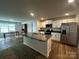Spacious kitchen with an island, stainless steel appliances, and a combined dining area at 2554 Goose Fair Rd, Maiden, NC 28650