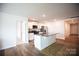 Modern kitchen with white cabinets, stainless steel appliances, and a granite-topped island at 2554 Goose Fair Rd, Maiden, NC 28650