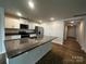Kitchen island with granite counters and stainless steel appliances; an open, modern design at 2554 Goose Fair Rd, Maiden, NC 28650