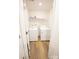 The laundry room includes a washer, dryer, shelving, and faux wood flooring at 2554 Goose Fair Rd, Maiden, NC 28650