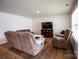 Comfortable living room features plush seating, laminate floors, and a warm atmosphere at 2554 Goose Fair Rd, Maiden, NC 28650