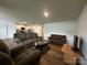 Comfortable living area featuring cozy furniture and an open concept layout with wood floors at 2554 Goose Fair Rd, Maiden, NC 28650