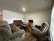 Inviting living room with lots of natural light, comfortable seating, and an entertainment area at 2554 Goose Fair Rd, Maiden, NC 28650