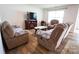 Cozy living room featuring hardwood floors, a TV, and comfortable furniture at 2554 Goose Fair Rd, Maiden, NC 28650