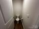 Small toilet room with a door providing privacy at 2554 Goose Fair Rd, Maiden, NC 28650
