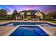 Luxury backyard showcasing a large pool, hot tub, covered patio, and outdoor seating area at 2854 Harlinsdale Dr, Rock Hill, SC 29732