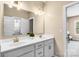 Bathroom featuring double sinks, white cabinetry and a large mirror at 2854 Harlinsdale Dr, Rock Hill, SC 29732