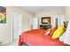 Bright bedroom with red bedding and several doors to closets at 2854 Harlinsdale Dr, Rock Hill, SC 29732