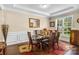 Formal dining room featuring a glass-top table, seating for eight and decorative accents at 2854 Harlinsdale Dr, Rock Hill, SC 29732
