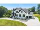 Beautiful two-story home with white brick, black trim, two-car garage and long driveway at 2854 Harlinsdale Dr, Rock Hill, SC 29732