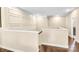 Upstairs hallway featuring white walls and dark wood floors, with trim work at 2854 Harlinsdale Dr, Rock Hill, SC 29732