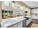 Bright and airy kitchen with white countertops, large island and views into the living area at 2854 Harlinsdale Dr, Rock Hill, SC 29732