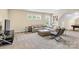 Inviting living room featuring plush seating, carpet, and natural light from multiple windows at 2854 Harlinsdale Dr, Rock Hill, SC 29732