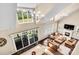 Open-concept living room with soaring ceilings, a fireplace, and natural light at 2854 Harlinsdale Dr, Rock Hill, SC 29732