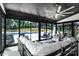 Sunroom with casual seating, sliding glass doors that open to a pool at 2854 Harlinsdale Dr, Rock Hill, SC 29732