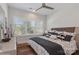 Bright bedroom featuring hardwood floors, plantation shutters, and a ceiling fan at 3006 Portico Pl # 37, Fort Mill, SC 29715