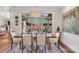 Elegant dining room with a rustic table, crystal chandelier, and expansive window view at 3006 Portico Pl # 37, Fort Mill, SC 29715