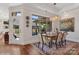Elegant dining room features a modern chandelier, stylish rug and an abundance of natural light at 3006 Portico Pl # 37, Fort Mill, SC 29715