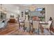 Open dining room with modern chandelier and open concept to kitchen and living areas at 3006 Portico Pl # 37, Fort Mill, SC 29715
