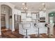 Modern kitchen with island seating, stainless steel appliances, and stylish pendant lights at 3006 Portico Pl # 37, Fort Mill, SC 29715